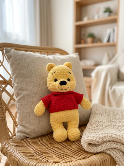 Copper Leaf Crochet Amigurumi Bear Pattern - crochet bear resting on a rattan chair with linen cushion