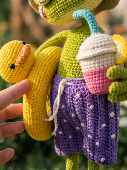 Close-up of the Pine Hollow Crochet Amigurumi Frog's duck float and polka-dot shorts stitch texture