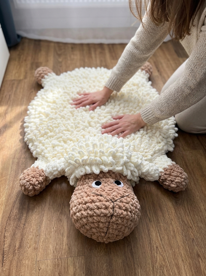 Tawny Owl Crochet Sheep Rug Pattern - hands smoothing the plush loop stitch crochet sheep rug on the floor