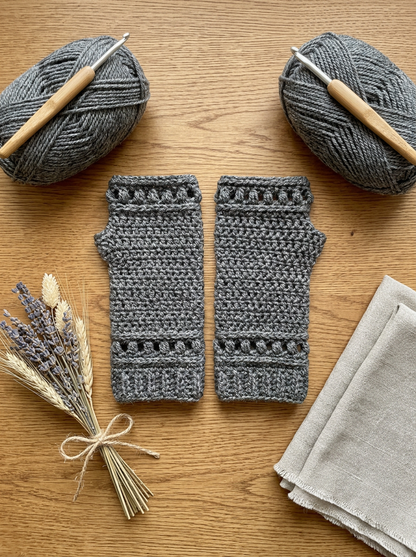 Fern Gully Crochet Fingerless Gloves Pattern - styled flat lay on a wooden table with dried flowers